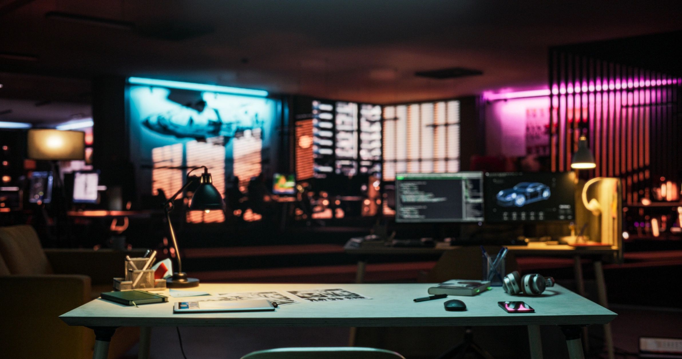 Modern gaming workspace with neon lighting and desk setup