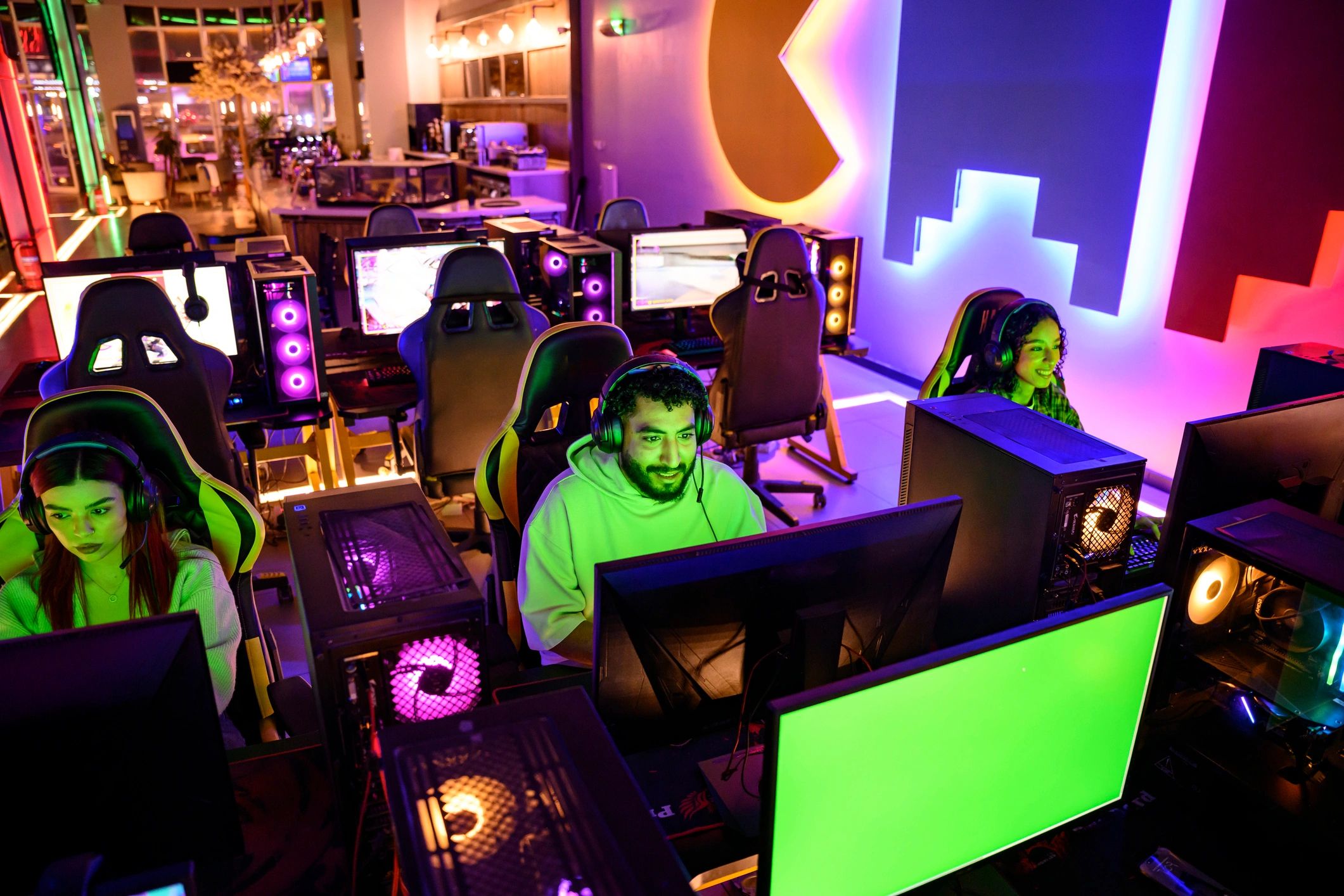Group of young gamers playing together in an esports venue